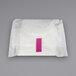 A white package of Naturelle Ultra Thin Maxi pads with a pink rectangular label.