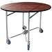 A Lakeside round room service table with wheels and a red maple finish.