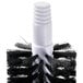 A close-up of a black and white Noble Products glass washer brush.