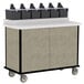 A Lakeside beige suede condiment cart with a row of black containers on top.