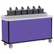 A purple Lakeside condiment cart with cup dispensers and black boxes on top.