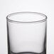A clear glass Libbey votive shot glass.