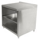 A stainless steel Advance Tabco cabinet base work table with a fixed mid shelf.