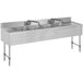 A stainless steel Advance Tabco underbar sink with four compartments and two drainboards.