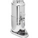 An Eastern Tabletop stainless steel milk dispenser with a central ice chamber and a handle.