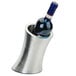 A stainless steel wine bottle holder with two walls at an angle holding a bottle of wine.