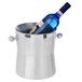 A stainless steel wine bucket holding a bottle of wine.