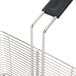 A stainless steel Vollrath fryer basket with a front hook handle.