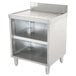 A stainless steel Advance Tabco underbar drainboard storage cabinet with two shelves on a mid-shelf.
