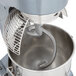 A mixer with a spiral dough hook inside.