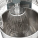 A 304 stainless steel wire whisk inside an Avantco mixer.