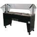 An Advance Tabco Four Pan Buffet Hot Food Table on black wheels with a clear cover.
