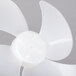 A close-up of a white plastic fan blade.