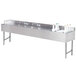 A stainless steel Advance Tabco underbar sink with four compartments and two ice bins.