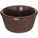 A brown bowl with a ribbed edge.