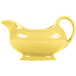 A yellow ceramic Fiesta sauce boat with a white interior and handle.