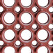 A close up of a red rubber surface with holes.