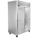 A Traulsen G Series white reach-in freezer with two solid doors.