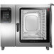 A Convotherm stainless steel electric combi oven with a tray inside.