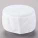 A white Headsweats chef skull cap with a white mesh top.