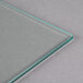 A clear glass surface with a thin green edge.