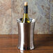 An American Metalcraft stainless steel double wall wine chiller with a wine bottle inside.