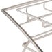 An American Metalcraft chrome folding three-tier display stand on a table.