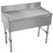 An Advance Tabco stainless steel free-standing bar drainboard with legs.