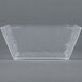 A clear square styrene bowl by American Metalcraft.