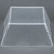 A clear plastic square American Metalcraft bowl with a ripple effect on a grey surface.