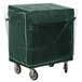 A green Cambro dish cart with wheels and a plastic cover.