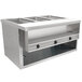 An Advance Tabco stainless steel electric sealed table with three pan openings.
