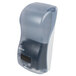 A San Jamar Rely Arctic Blue hybrid touchless foam soap dispenser with a plastic cover.