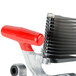 A close up of a red and black metal Vollrath InstaSlice pusher head assembly with a red handle.