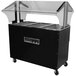 An Advance Tabco stainless steel hot food table with black base and clear top.