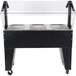 A black and silver Advance Tabco open base hot food table on a counter.