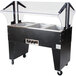 An Advance Tabco stainless steel electric hot food table with an open well and clear glass top.