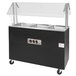 A black and silver food warmer cart with glass doors.