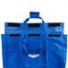 A blue fabric Vollrath storage bag with black straps.