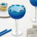 A blue shark margarita in a Libbey Super Stems cocktail glass.