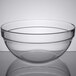 An Arcoroc clear glass bowl on a table.