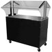 A black and clear food cart with a black and silver base with the Advance Tabco Everyday Buffet Table on top.