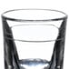 A Libbey fluted shot glass with a silver rim.