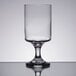 A close-up of a Libbey Lexington wine glass on a reflective surface.