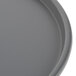 A close-up of a Chicago Metallic grey perforated pizza pan.