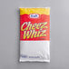 A red and white package of Kraft CHEEZ WHIZ Cheese Sauce with yellow text.
