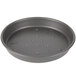 A round black Chicago Metallic BAKALON pizza pan with holes in it.