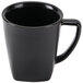 A black Hall China mug with a handle.