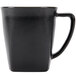 A black Hall China mug with a handle.