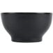 A black Hall China chili bowl with a white background.